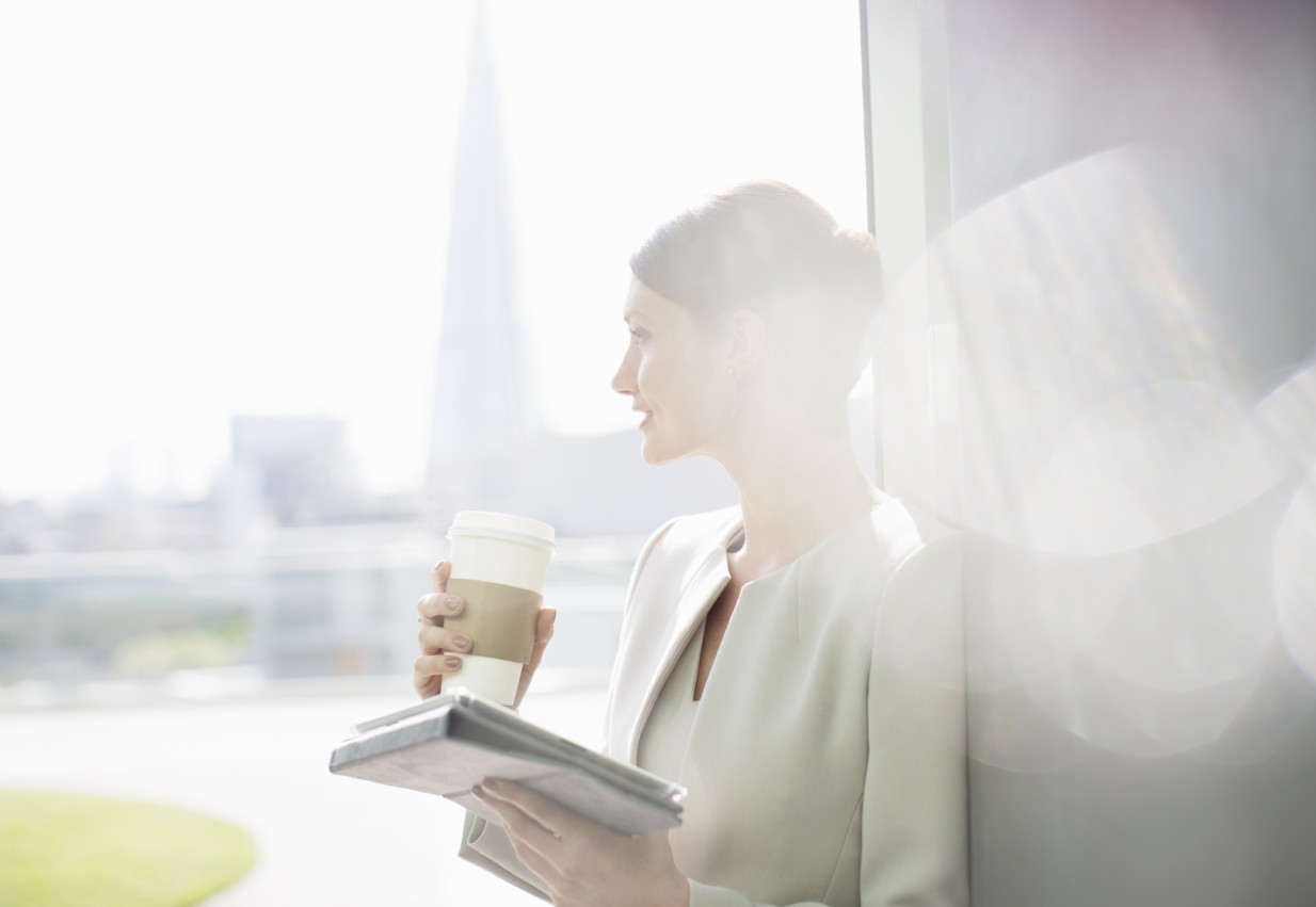 woman-with-coffee-looking-out-window (2)